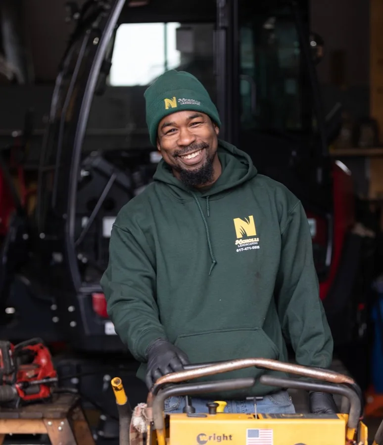 Nicholls Landscaping team member with equipment